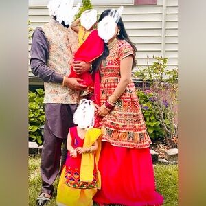 Multi-colored/pattern frock shirt with magenta lengha and magenta net duppata